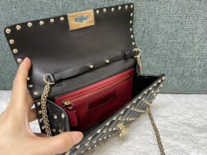 rockstud-spike-nappa-leather-crossbody-clutch-bag